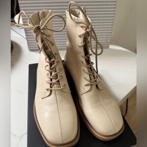 Faux leather square toed lace up boots with zippers in the back for easy wear.
